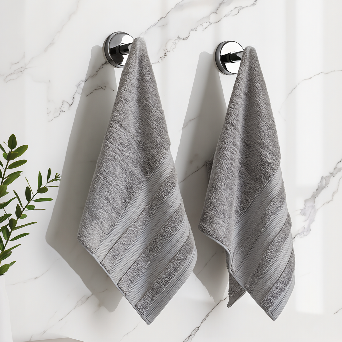 Ash Grey Melluva hand towels hanging on a bathroom hook