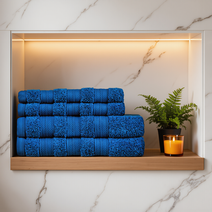 Denim Melluva 4 piece towel set stacked on a bathroom shelf