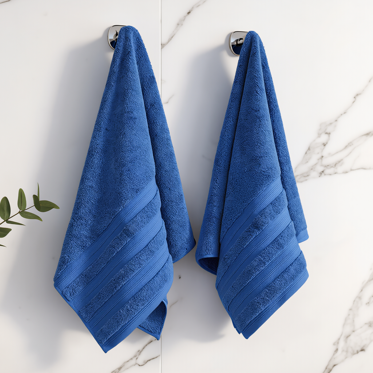 Denim Melluva hand towels hanging on a bathroom hook