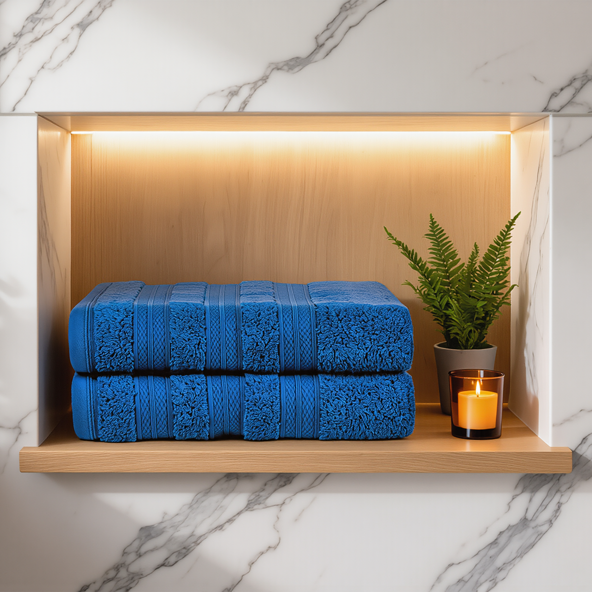 Denim Melluva Turkish cotton towels, set of 2, folded on a bathroom shelf