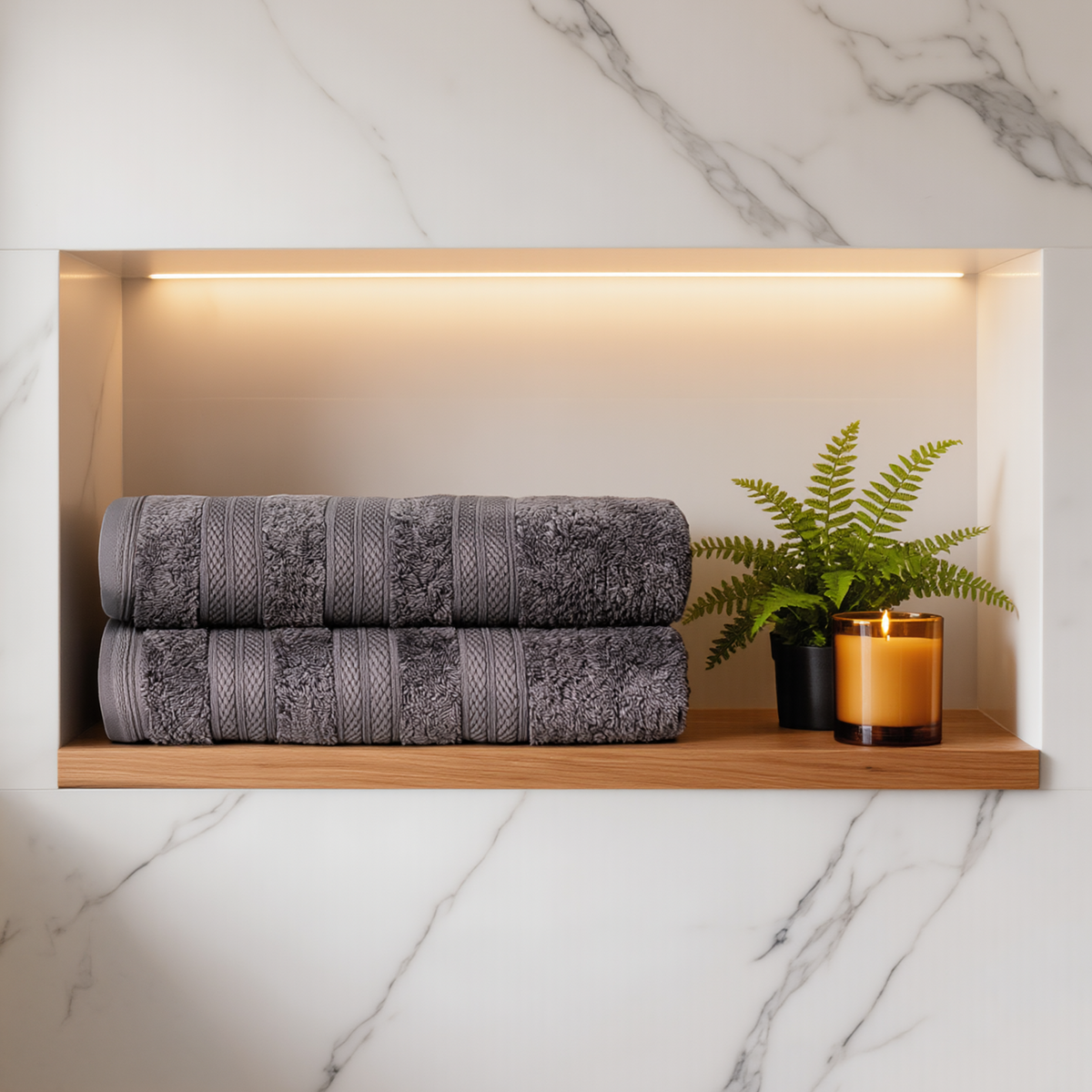 Dow Grey Melluva Turkish cotton towels, set of 2, folded on a bathroom shelf